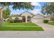 Inviting single-story home featuring a manicured lawn and a charming facade at 11611 Jordans Landing Ct, Riverview, FL 33569