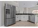 Spacious kitchen featuring a stainless steel refrigerator and sleek appliances at 11611 Jordans Landing Ct, Riverview, FL 33569
