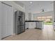 Bright kitchen with stainless steel appliances and granite countertops at 11611 Jordans Landing Ct, Riverview, FL 33569