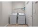 Laundry room with modern white washer and dryer at 11611 Jordans Landing Ct, Riverview, FL 33569