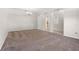 Spacious living room with neutral walls, soft carpeting and arched entryways at 11611 Jordans Landing Ct, Riverview, FL 33569