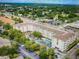 Aerial view of the condo complex showing the buildings, parking, and a central pool at 1216 S Missouri Ave # 321, Clearwater, FL 33756