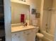 Bright bathroom with a shower and tub combo next to a large vanity and mirror at 1216 S Missouri Ave # 321, Clearwater, FL 33756