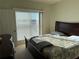 Comfortable bedroom with a large window and a cozy bed at 1216 S Missouri Ave # 321, Clearwater, FL 33756