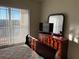 Comfortable bedroom with large window, dresser with mirror, and cozy decor at 1216 S Missouri Ave # 321, Clearwater, FL 33756