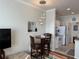 Cozy dining area with modern lighting and a view into the well-equipped kitchen at 1216 S Missouri Ave # 321, Clearwater, FL 33756