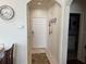 Inviting entryway with decorative clock, welcome sign, and neutral color palette at 1216 S Missouri Ave # 321, Clearwater, FL 33756