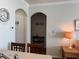 Hallway showing architectural details with an arched entryway, a clock, and decorative wall elements at 1216 S Missouri Ave # 321, Clearwater, FL 33756