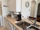 Efficient kitchen layout with modern appliances, ample counter space, and white cabinetry at 1216 S Missouri Ave # 321, Clearwater, FL 33756