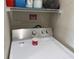 Efficient laundry area with modern dryer and storage shelves at 1216 S Missouri Ave # 321, Clearwater, FL 33756