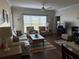 Inviting living room featuring a plush sofa, chairs, and stylish decor at 1216 S Missouri Ave # 321, Clearwater, FL 33756