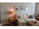 Relaxing living room area with a plush sofa, accent pillows, and decorative wall art at 1216 S Missouri Ave # 321, Clearwater, FL 33756