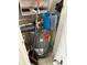 A utility closet with a hot water heater, mop, and bucket of cleaning supplies at 1216 S Missouri Ave # 321, Clearwater, FL 33756