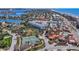 Beautiful aerial view of condos with a pool, tennis court, and access to beach and intercoastal waterways at 125 Shoals Cir, North Redington Beach, FL 33708