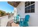 Inviting balcony featuring comfortable Adirondack chairs and a charming view of the neighborhood street at 125 Shoals Cir, North Redington Beach, FL 33708