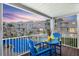 Charming balcony overlooking pool, perfect for relaxing and enjoying the views and has seating for two at 125 Shoals Cir, North Redington Beach, FL 33708