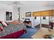 Comfortable bedroom with a zebra-patterned bed, desk area, balcony access, and ample natural light at 125 Shoals Cir, North Redington Beach, FL 33708