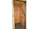 Interior view of the elevator featuring paneling, handrail, and control panel at 125 Shoals Cir, North Redington Beach, FL 33708