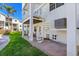 Backyard area with a spiral staircase and views of the surrounding landscaping and building at 125 Shoals Cir, North Redington Beach, FL 33708