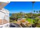 Scenic exterior view with lush greenery and blue water in the background at 125 Shoals Cir, North Redington Beach, FL 33708