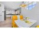 Eat-in kitchen featuring a breakfast bar and a cozy booth with a round window at 125 Shoals Cir, North Redington Beach, FL 33708