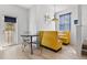 Eat-in kitchen featuring a booth with a round window and access to the backyard at 125 Shoals Cir, North Redington Beach, FL 33708