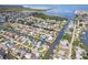 An attractive aerial view of a coastal community, featuring canal-front homes and boating access at 13437 Lisa Dr, Hudson, FL 34667