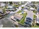 Overhead view of a waterfront house with dock, landscaping, and canal access at 13437 Lisa Dr, Hudson, FL 34667