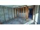 Unfinished bedroom featuring block walls, framing, and a concrete floor ready for customization at 13437 Lisa Dr, Hudson, FL 34667