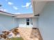 Inviting front entrance with a tiled patio and freshly painted exterior at 13437 Lisa Dr, Hudson, FL 34667