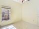 Light-filled bedroom with tile flooring and natural light, perfect for a cozy retreat at 13542 Norman Cir, Hudson, FL 34669