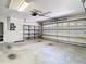 Spacious garage with ample storage, offering parking and organizational solutions at 13542 Norman Cir, Hudson, FL 34669