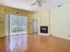 Living room with sliding glass doors, fireplace, and parquet flooring offers a cozy atmosphere at 13542 Norman Cir, Hudson, FL 34669