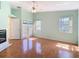Living room with hardwood floors, large windows, and a cozy fireplace at 13542 Norman Cir, Hudson, FL 34669