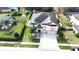 Expansive property with a well-maintained lawn, privacy fence, mature trees, and an inviting outdoor play area at 13856 Crest Lake Dr, Hudson, FL 34669