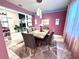 Dining room features a table and chairs, with art on the wall at 13856 Crest Lake Dr, Hudson, FL 34669