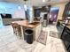 Updated kitchen island with sink and stainless steel appliances at 13856 Crest Lake Dr, Hudson, FL 34669