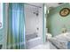 This bathroom features a shower-tub combo and marble countertop sink at 1400 1St W Ave # G1, Bradenton, FL 34205