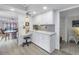 Well-lit kitchen features modern appliances, white cabinetry, and convenient workspace at 1400 1St W Ave # G1, Bradenton, FL 34205