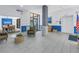 Comfortable lobby area with chairs, tile flooring, and views to the outside at 1400 1St W Ave # G1, Bradenton, FL 34205
