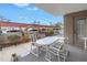 Cozy covered patio with pleasant outdoor dining space and greenery at 1400 1St W Ave # G1, Bradenton, FL 34205