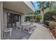 Lovely outdoor patio with dining set and water feature provides a relaxing retreat at 1400 1St W Ave # G1, Bradenton, FL 34205