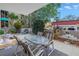 Comfortable patio setting with outdoor seating, fountain, and garden views at 1400 1St W Ave # G1, Bradenton, FL 34205