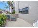 Private patio with relaxing lounge chair and vibrant tropical plants at 1400 1St W Ave # G1, Bradenton, FL 34205