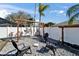 Backyard featuring a stone patio, a hammock, and a privacy fence at 1425 Monte Lake Dr, Valrico, FL 33596