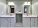 Bathroom featuring a double vanity with marble countertops and dual mirrors at 1425 Monte Lake Dr, Valrico, FL 33596