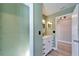 Bathroom featuring an updated vanity with a mirror, light fixtures, and neutral walls at 1425 Monte Lake Dr, Valrico, FL 33596
