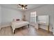 Bright bedroom featuring a ceiling fan, natural light, and a stylish vanity at 1425 Monte Lake Dr, Valrico, FL 33596