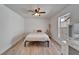 Bright bedroom featuring a ceiling fan and natural light from the window at 1425 Monte Lake Dr, Valrico, FL 33596