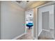 View of a bedroom featuring neutral walls and a ceiling fan through an open doorway at 1425 Monte Lake Dr, Valrico, FL 33596